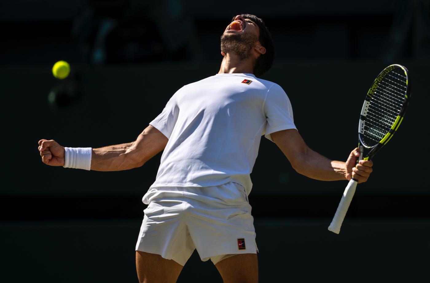 Alcaraz celebra su victoria. - @Wimbledon / X